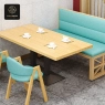 A close-up of a light-blue booth with a wooden table and matching chairs.