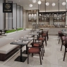 A long, light gray stone tabletop with a black metal base and chairs.