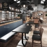 A rectangular office table with a black double pedestal, paired with gray chairs.