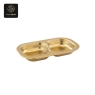 A polished gold stainless steel dish, divided into two compartments.