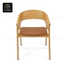A front view of the Nordic solid wood chair, showing its full design and cushion.