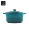 A blue enamel cast iron dutch oven with a lid on, shown from a front view.