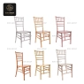 A set of six bamboo-style banquet chairs in different metallic colors.