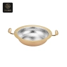 A single oval chafing dish with a gold rim and hammered silver interior.