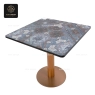A square table with a dark blue decorative pattern and a wood-like base.