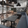 An office space with a large rectangular table and modern chairs.
