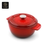 A red enamel cast iron dutch oven with 'Success' embossed on the lid.