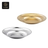 A pair of hammered service plates, one gold and one silver.