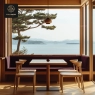 A wooden-themed dining space with chairs, a table, and a built-in bench, facing an ocean view.