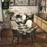 Two-tone dining armchairs in a restaurant setting.