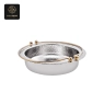A round chafing dish with a hammered silver interior and a golden rim.