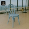 An elegant blue bentwood chair with a classic circular seat and curved back.
