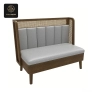 A single beige leatherette booth with a high-back and a wooden frame.