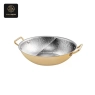 A gold-colored oval chafing dish, hammered and divided, with two handles.