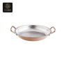 A single copper-colored serving pan with hammered silver interior and two handles.