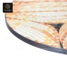 A close-up of a round mosaic table top with a gray metal rim.