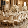 A formal banquet hall with long tables and gold-framed medallion chairs.