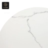 A close-up of the white stone table top showing the detailed marble pattern.