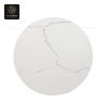 A round, white stone table top with gray marble-like veining.
