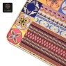 A close-up of the rectangular table top with a vibrant, unique pattern and golden edge.