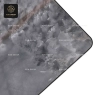 A dark gray stone tabletop with rounded corners and a polished silver central base.