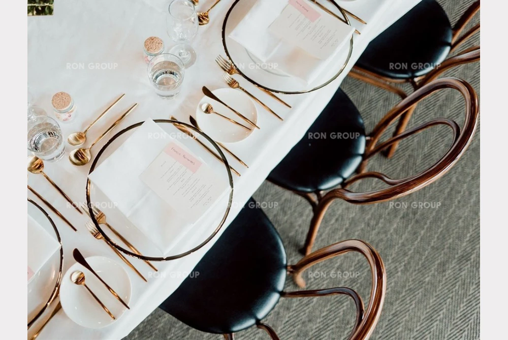 RON GROUP Sophisticated Tableware and Furniture Details Wedding table setting with gold cutlery and RON GROUP bentwood chairs