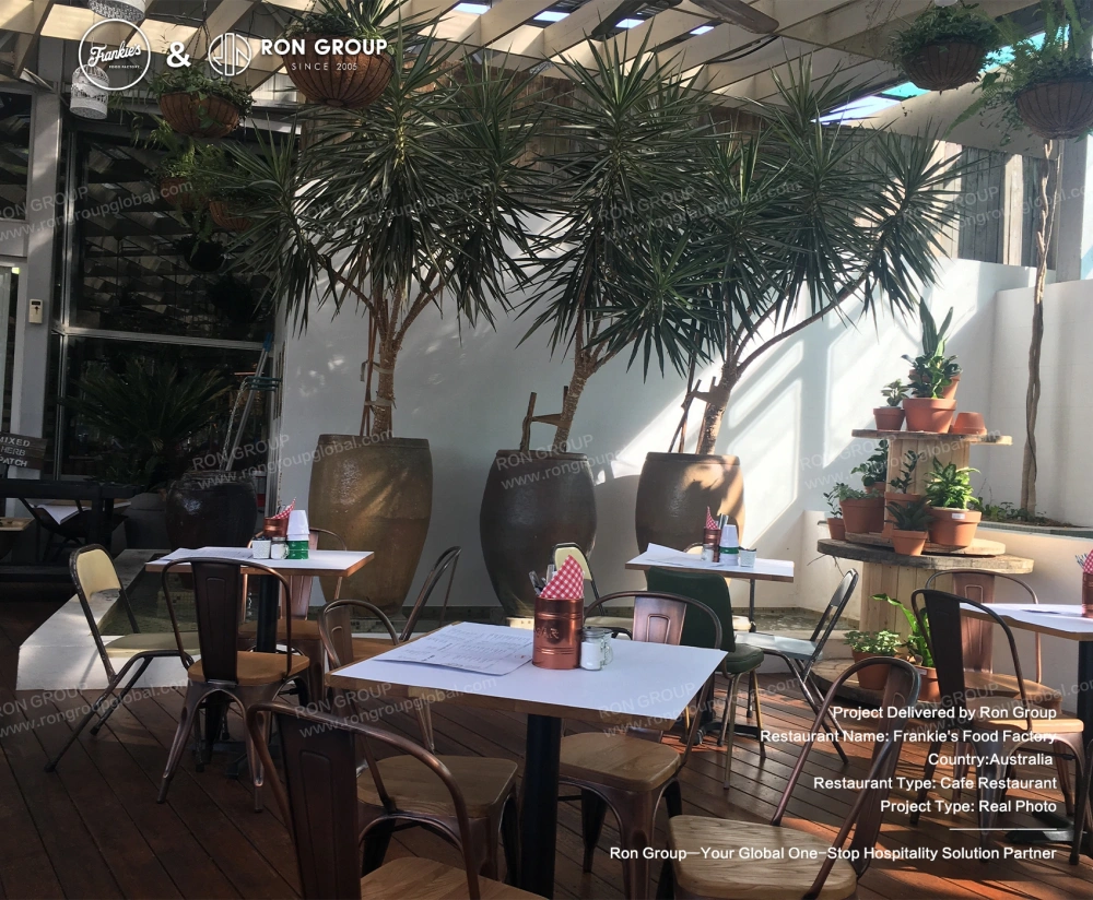 RON-GROUP_FRANKIES-FOOD-FACTORY_Outdoor-Deck-with-Potted-Greenery RON-GROUP_FRANKIES-FOOD-FACTORY_Outdoor-Deck-with-Potted-Greenery