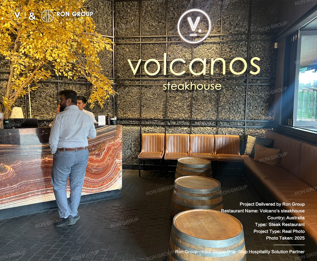 Volcano's Steakhouse project by RON GROUP Interior overview of Volcano's Steakhouse featuring custom booth seating, warm lighting, and upscale steakhouse atmosphere