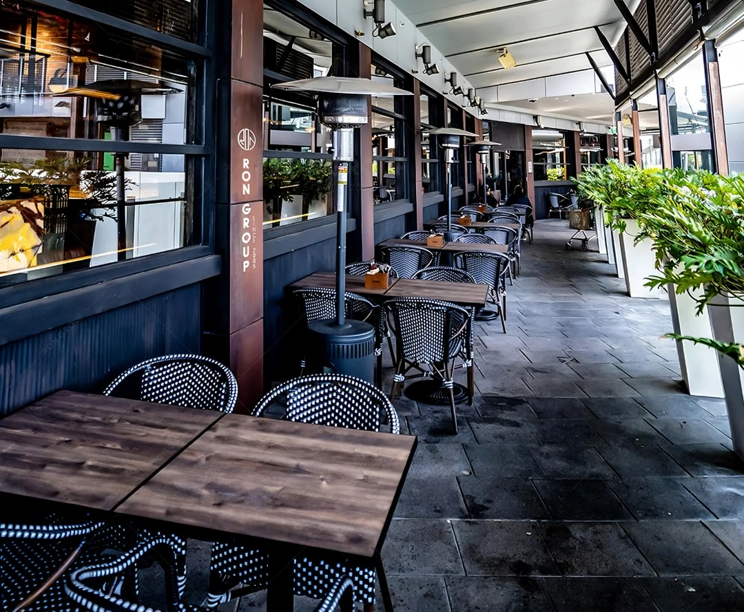 Outdoor terrace setup at Volcano's Steakhouse Outdoor patio with dining furniture, planters, and patio heaters at Volcano's Steakhouse