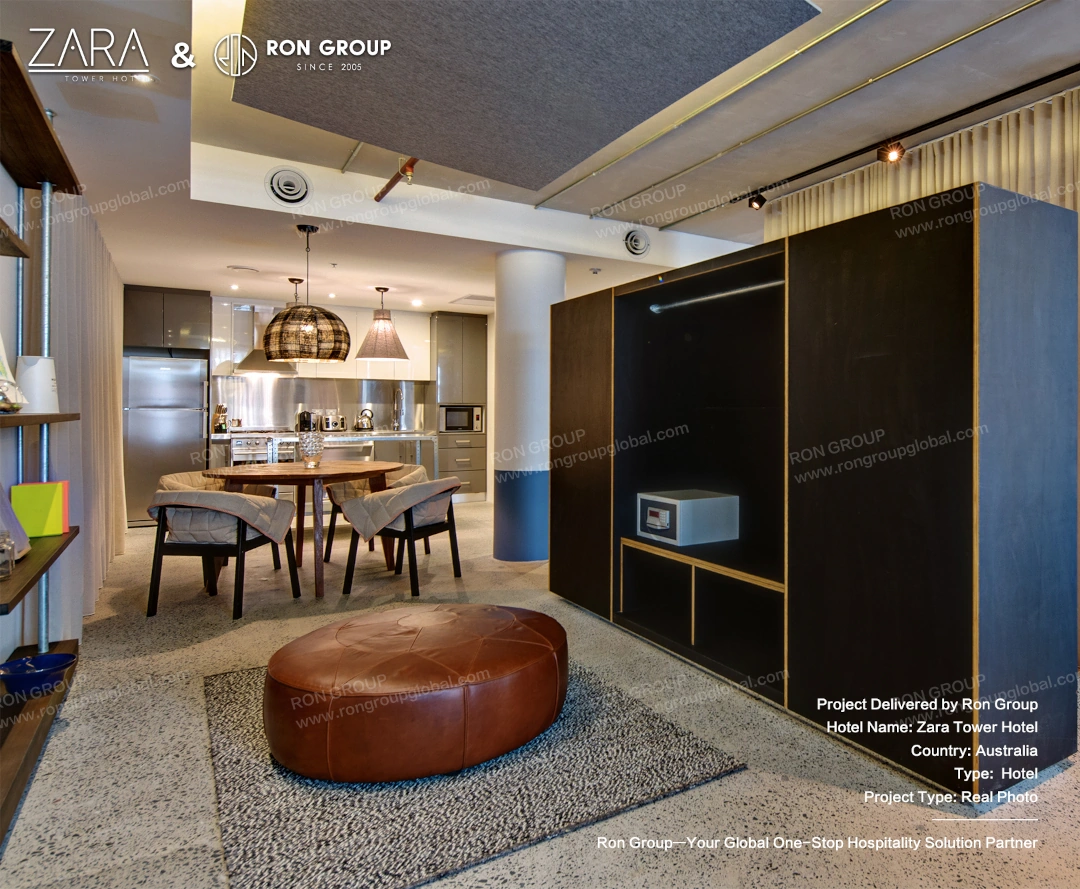A custom-built wooden wardrobe and dining table unit that optimizes space in the SoHo suites