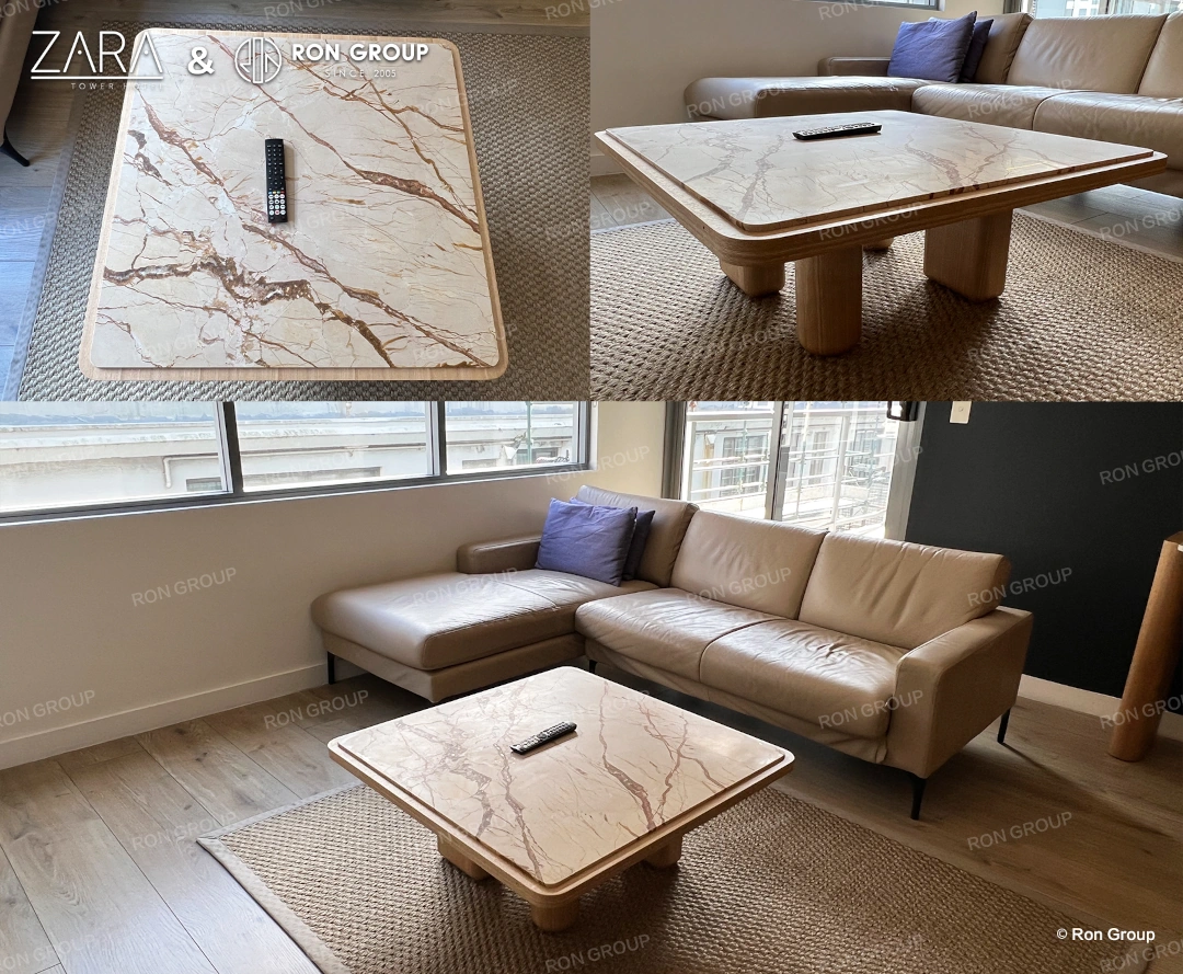 A detailed view of a custom marble coffee table showcasing natural stone veining and wooden frame.