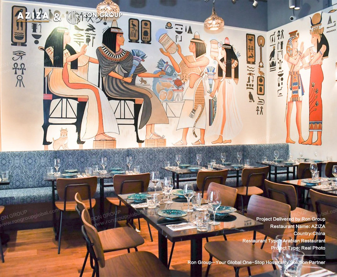 Banquette seating against a large Egyptian mural painting