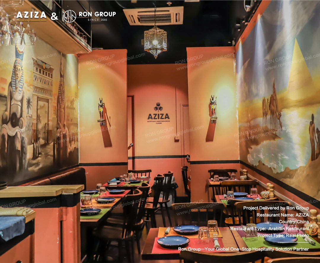 Dining nook featuring large pyramid wall art and soft booth seating