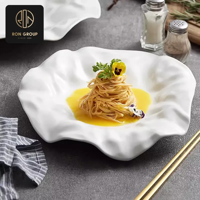 Shallow wide-mouth porcelain pasta and risotto bowl showing smooth vitrified interior curve
